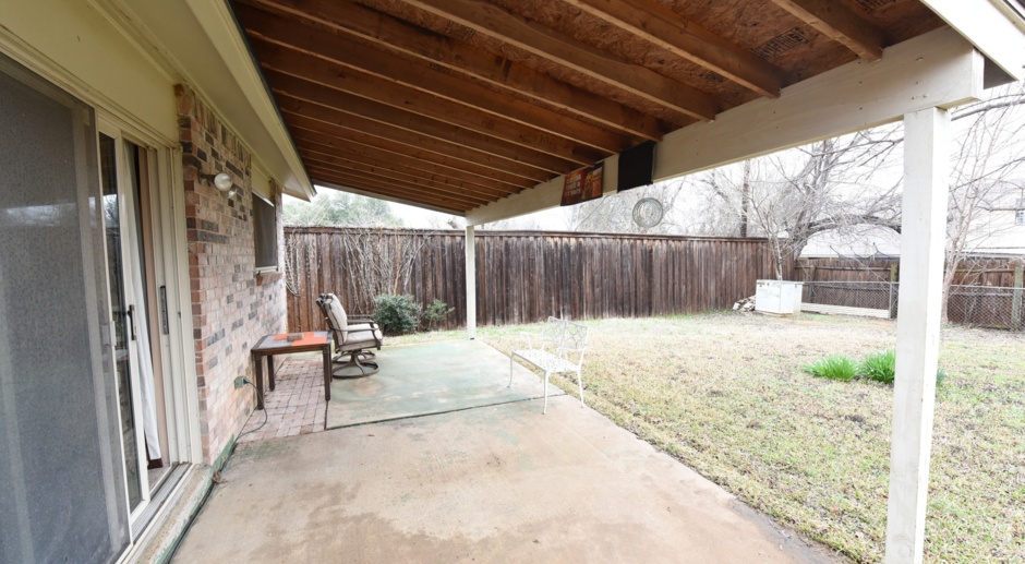 Well-maintained home with a huge yard and covered patio! 