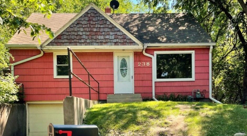 CLOSE TO VCSU:  Four bedroom 2 bath home with tuck-under garage