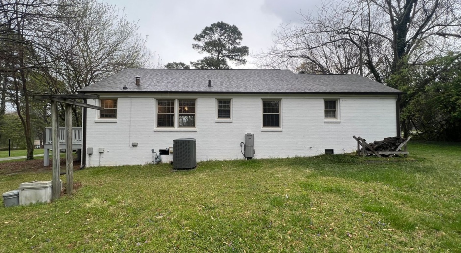 Authentic 3BD, 2BA Raleigh Home with Spacious Yard and Wood Burning Fireplace